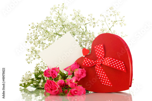 Photo: Giftbox and flowers isolated on white Giftbox and flowers isolated on white