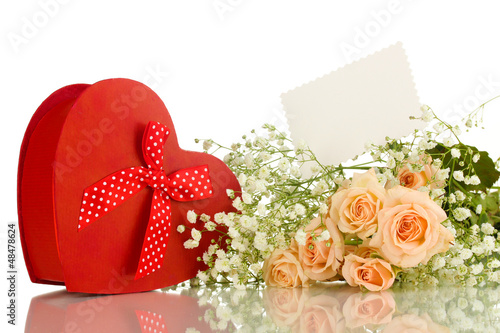 Photo: Giftbox and flowers isolated on white Giftbox and flowers isolated on white