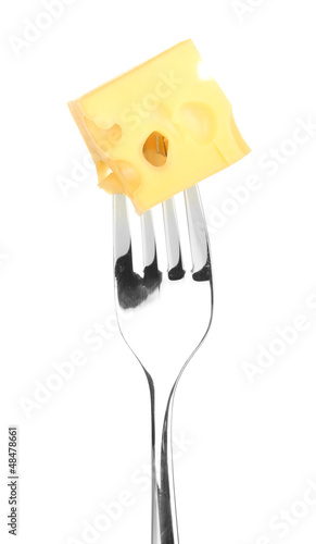 Photo: Cheese cube on fork isolated on white Cheese cube on fork isolated on white