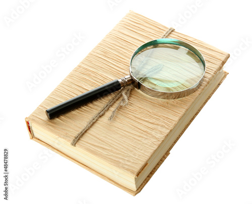 Photo: Magnifying glass and book isolated on white Magnifying glass and book isolated on white