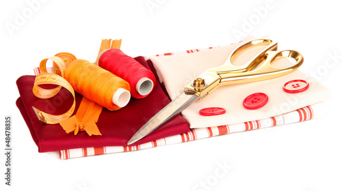 Photo: Sewing accessories and fabric isolated on white Sewing accessories and fabric isolated on white