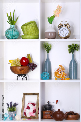 Photo: Beautiful white shelves with different home related objects Beautiful white shelves with different home related objects