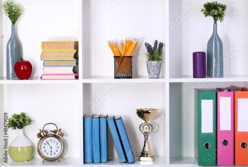 Photo: Beautiful white shelves with different home related objects Beautiful white shelves with different home related objects