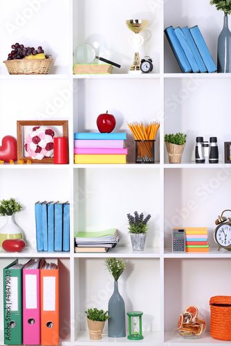Photo: Beautiful white shelves with different home related objects Beautiful white shelves with different home related objects