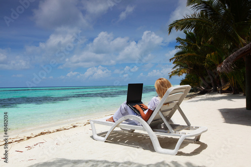 Photo: tropical business woman with laptop tropical business woman with laptop