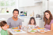 Smiling family having dinner