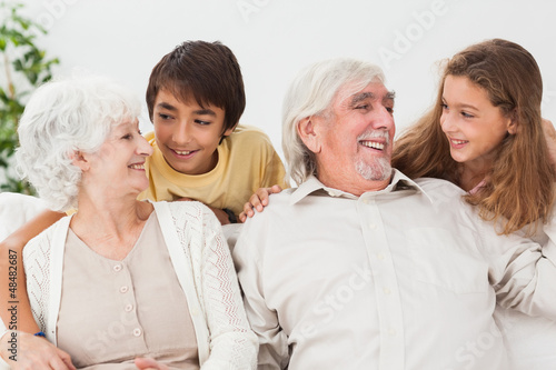 Photo: Grandparents with grandchildren on the couch Grandparents with grandchildren on the couch