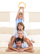 Jolly family having fun with yellow house illustration