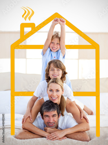 Photo: Family having fun with yellow drawing house Family having fun with yellow drawing house