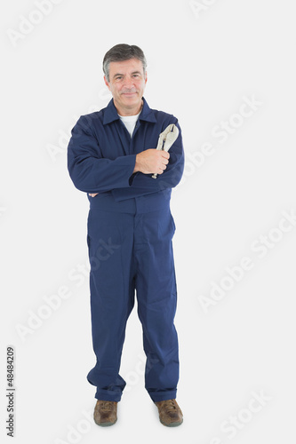 Photo: Technician holding locking pliers Technician holding locking pliers