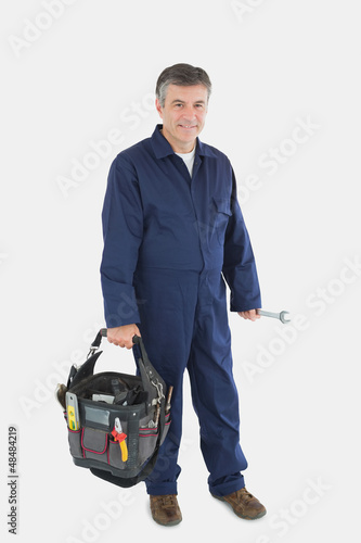 Photo: Mechanic carrying tool bag Mechanic carrying tool bag