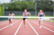 Athletes running towards finish line