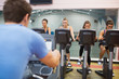 Man instructs spinning class
