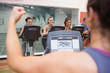 Happy people in spinning class