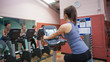 Happy people take spinning class