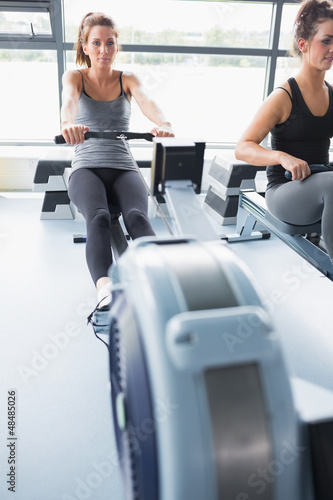 Photo: Woman using rowing machine Woman using rowing machine