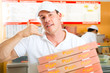 Photo: Delivery service - man holding pizza boxes Delivery service - man holding pizza boxes