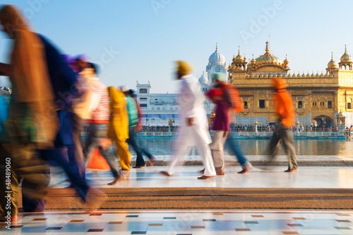 Photo: Group of Sikh pilgrims walking by the Golden Temple Group of Sikh pilgrims walking by the Golden Temple