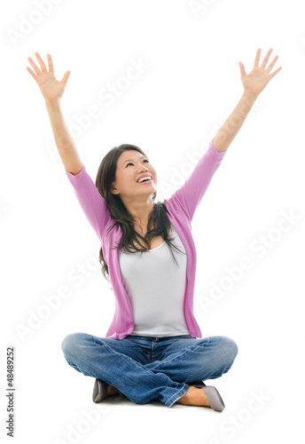 Photo: Happy Asian woman arms opened looking up Happy Asian woman arms opened looking up