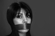 Gagged woman not allowed to speak, monochrome