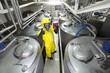 Technician controlling industrial process with thumb up gesture