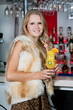 A beautiful young woman enjoying a cocktail