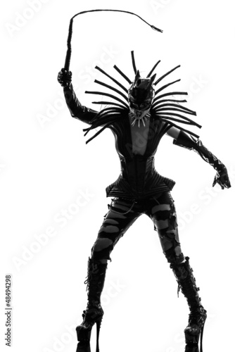 Photo: woman in catwoman leather latex fetish wear silhouette woman in catwoman leather latex fetish wear silhouette
