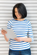 happy teenage girl with tablet pc computer
