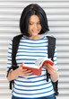 woman with bag and book