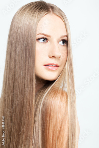 Photo: Portrait of young woman with long hair Portrait of young woman with long hair