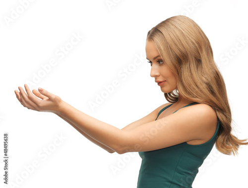 Photo: woman holding something on the palms woman holding something on the palms