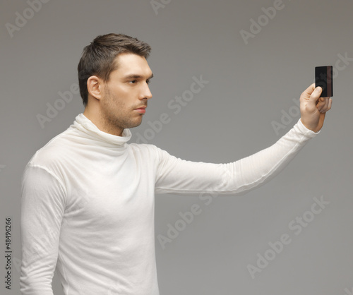 Photo: man with access card man with access card