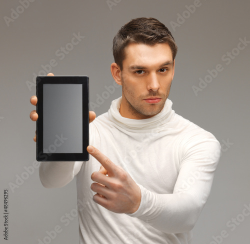 Photo: man with tablet pc man with tablet pc