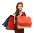 teenage girl in red dress with shopping bags