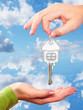 Photo: Hand with a home key. Hand with a home key.