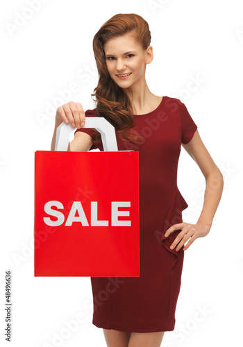 Photo: teenage girl in red dress with sale sign teenage girl in red dress with sale sign