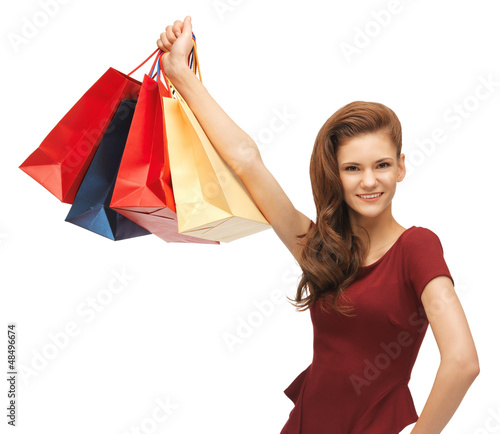 Photo: happy teenage girl with shopping bags happy teenage girl with shopping bags
