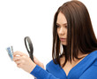 woman with magnifying glass and euro cash money