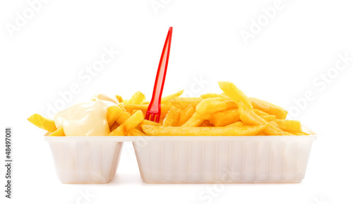 Photo: Portion of fries with mayonnaise and plastic fork Portion of fries with mayonnaise and plastic fork