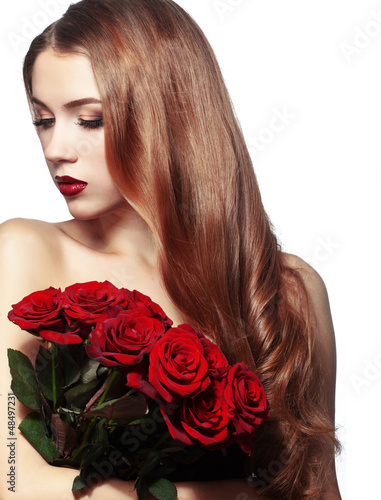 Photo: Beautiful girl holding bunch of roses Beautiful girl holding bunch of roses