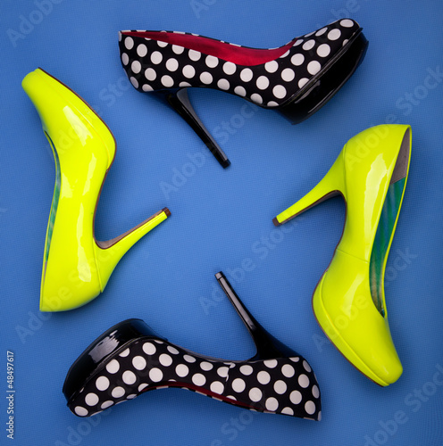 Photo: Colorful high heels on blue background Colorful high heels on blue background