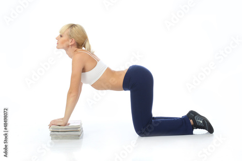 Photo: Athletic girl doing exercises Athletic girl doing exercises