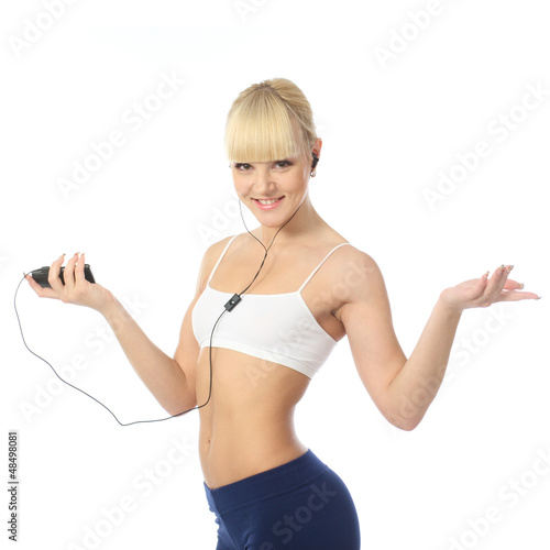 Photo: Athletic girl talking on the phone through the headset Athletic girl talking on the phone through the headset