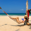 Woman in hammock on beach