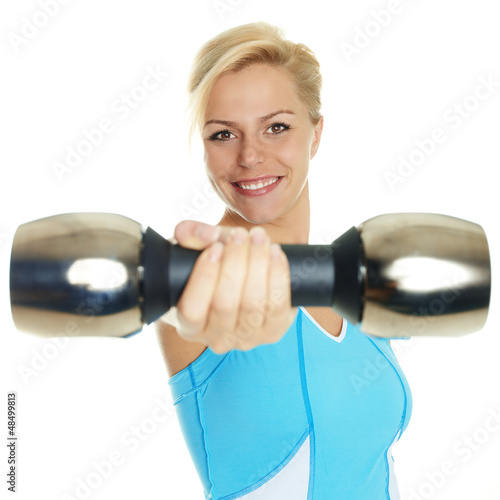 Photo: Atletic woman has fun to exercise with free weights Atletic woman has fun to exercise with free weights
