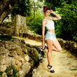 Pin-up girl. American style, in a garden