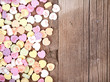heart shape candy on wooden plank