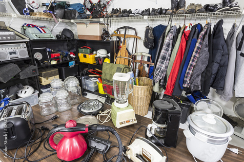 Photo: Interior garage sale, housewares, clothing, and more. Interior garage sale, housewares, clothing, and more.