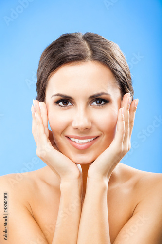 Photo: Portrait of beautiful woman, on blue Portrait of beautiful woman, on blue