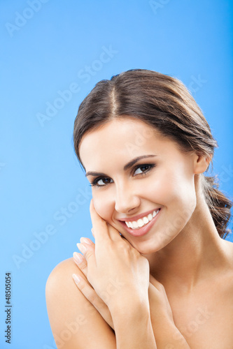 Photo: Portrait of beautiful woman, on blue Portrait of beautiful woman, on blue